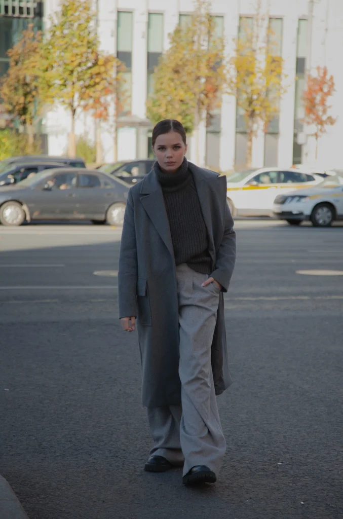 a woman wearing relaxed trousers and sweater fall outfit